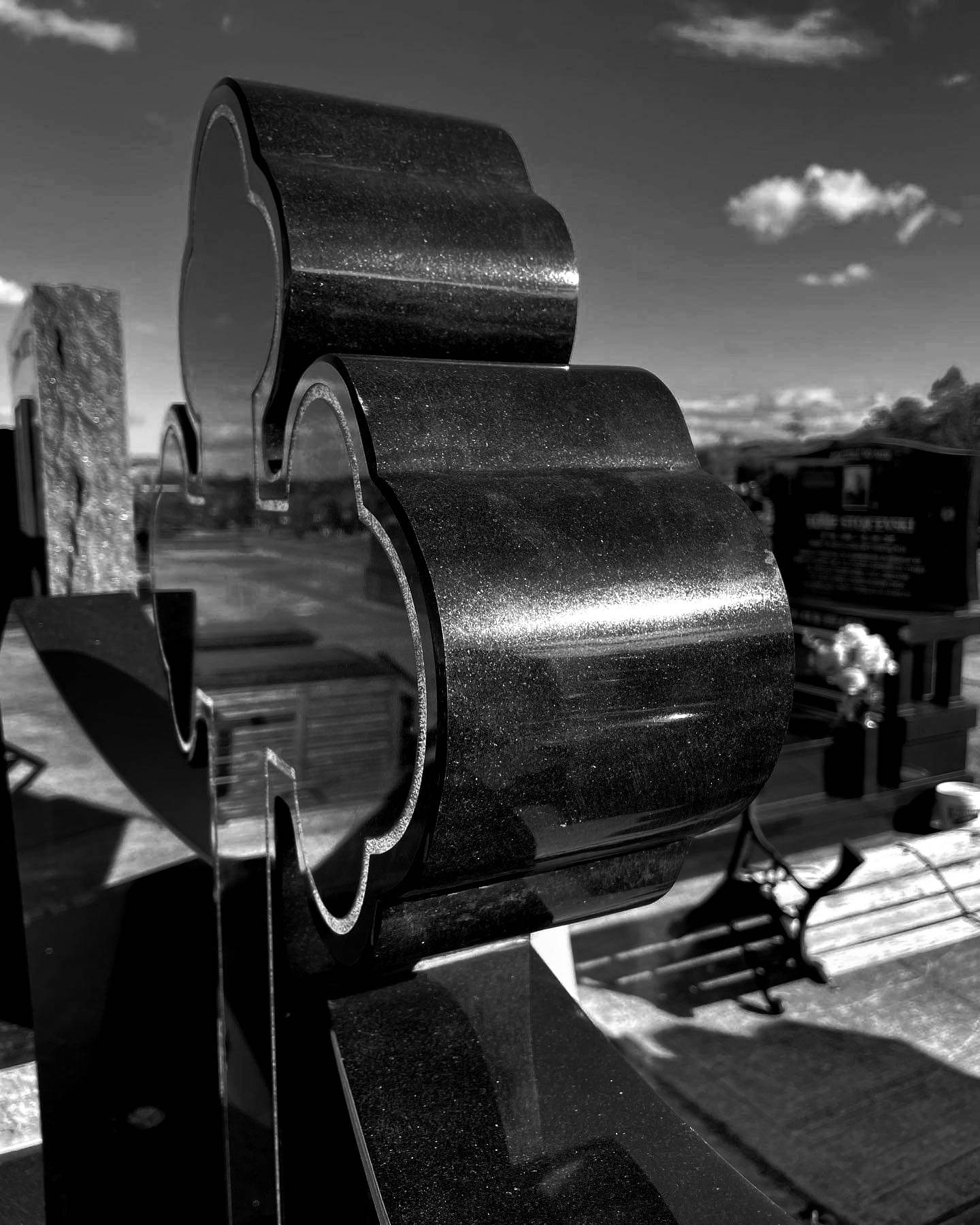 Photo of black cross grave headstone in Wollongong Cemetery
